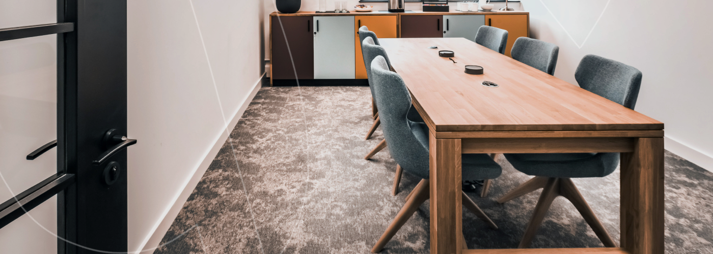 What is a flexible office space? A photograph showing one of the types of flexible office spaces with a table and six chairs, with power access and tea and coffee facilities